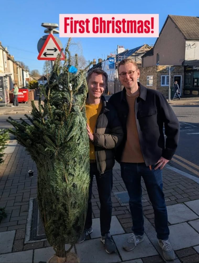 Two friends celebrating their first Christmas with a netted Nordmann fir