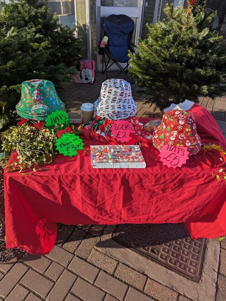 Our red-covered stall with festive hats, socks and mistletoe